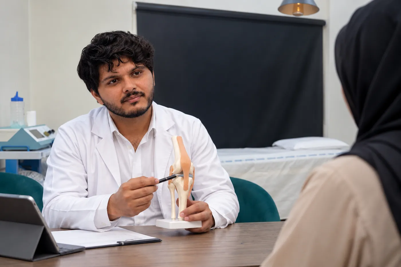 WHPT Pakistan physiotherapist in Bahria Town Lahore reviewing knee rehabilitation progress